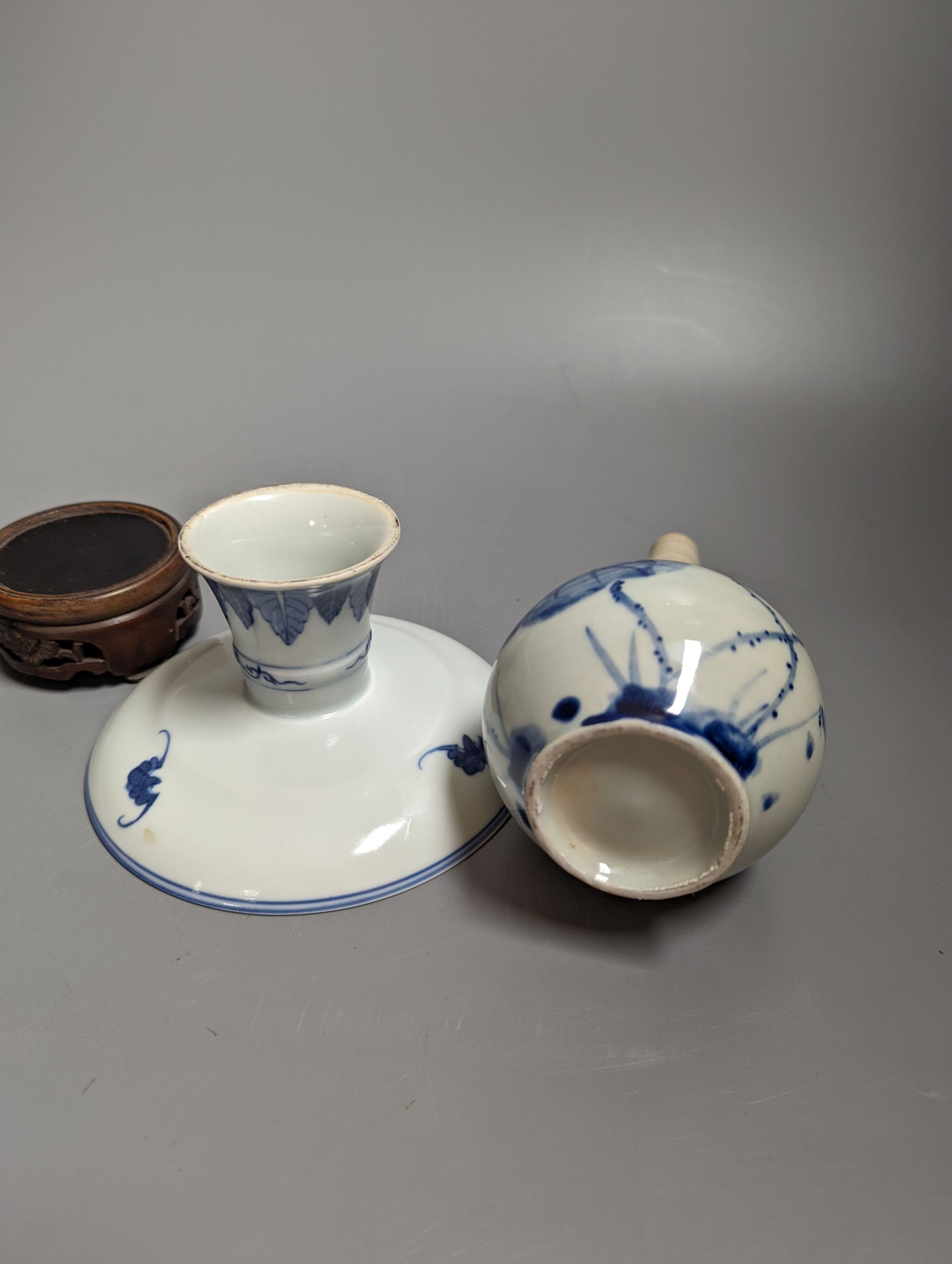 A 19th century Chinese blue and white stem dish, 14cm diameter and a Japanese or Korean art pottery bottle vase, 19cm (2)